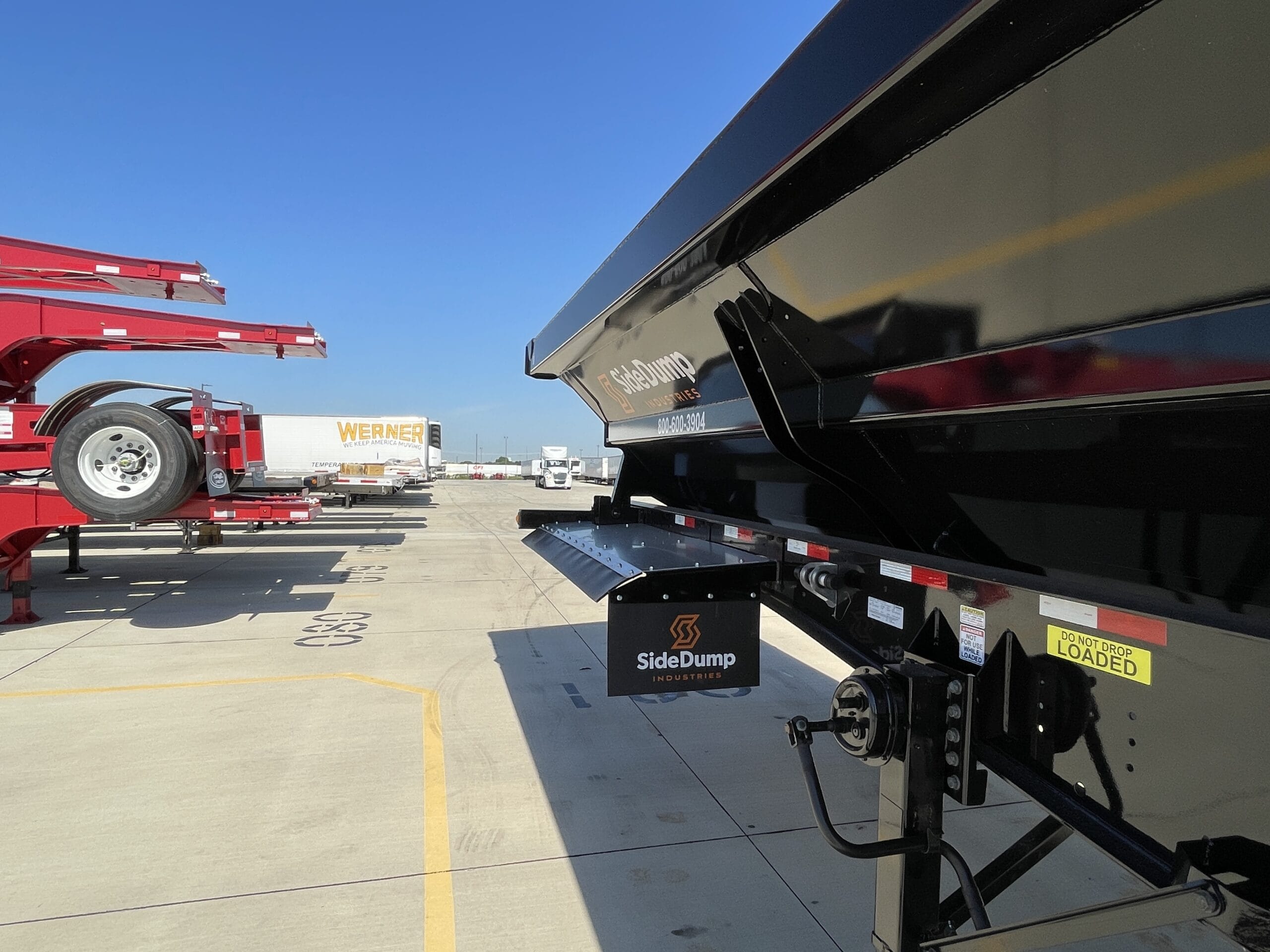 Side dump trailers and chassis in stock at River-Roads sales and service