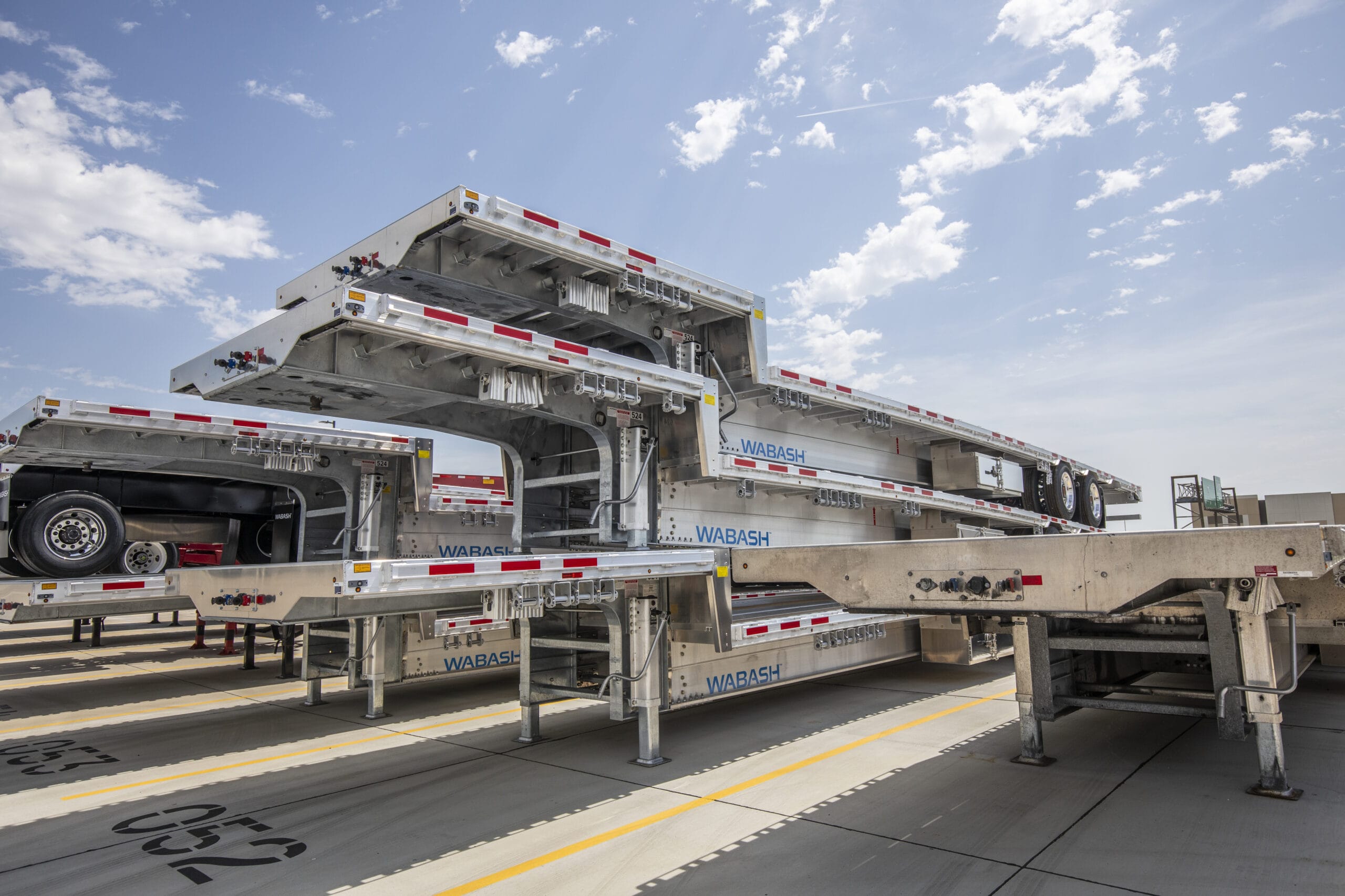 Wabash Drop-Deck platform trailers stacked in storage yard