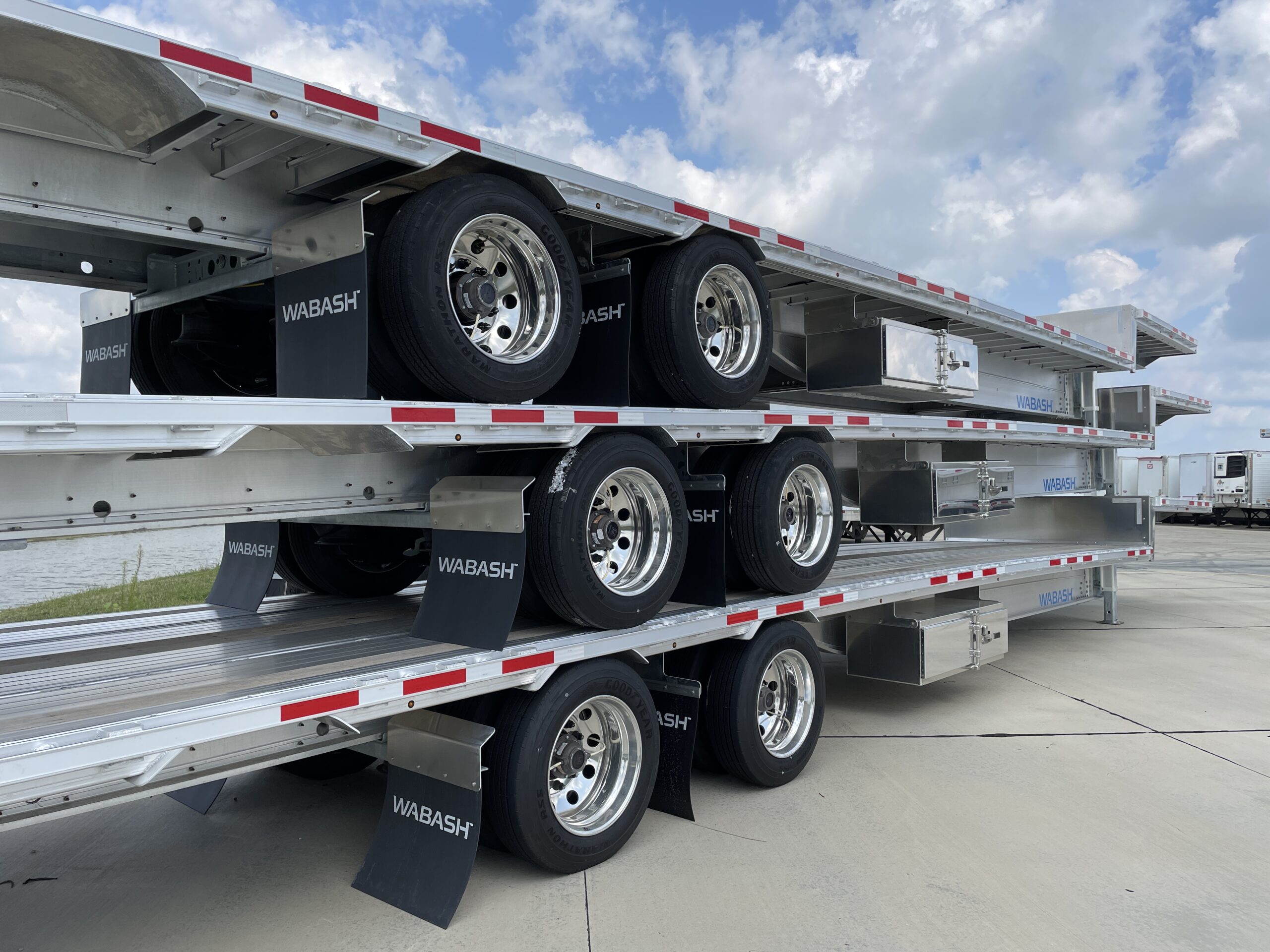 Wabash drop deck platform trailers stacked in inventory